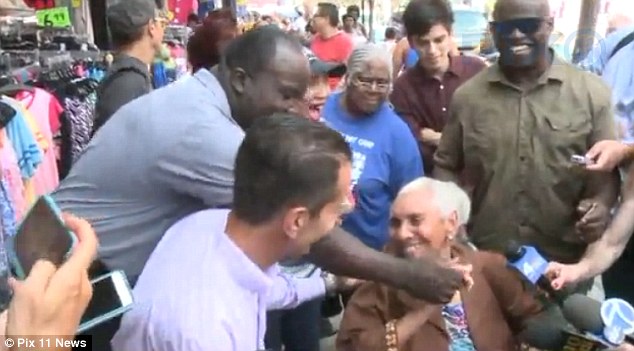 The great-grandmother was all smiles as Cohen and the store's manager William presented her with the check and a pair of sandals she had wanted that day